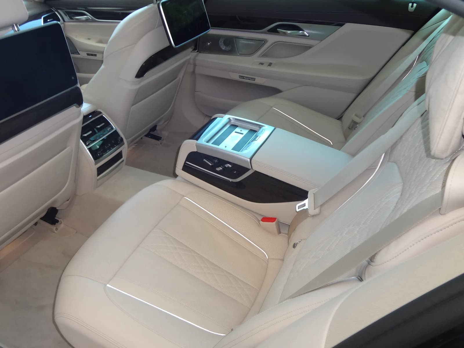 Light-coloured rear passenger seats and footwells.